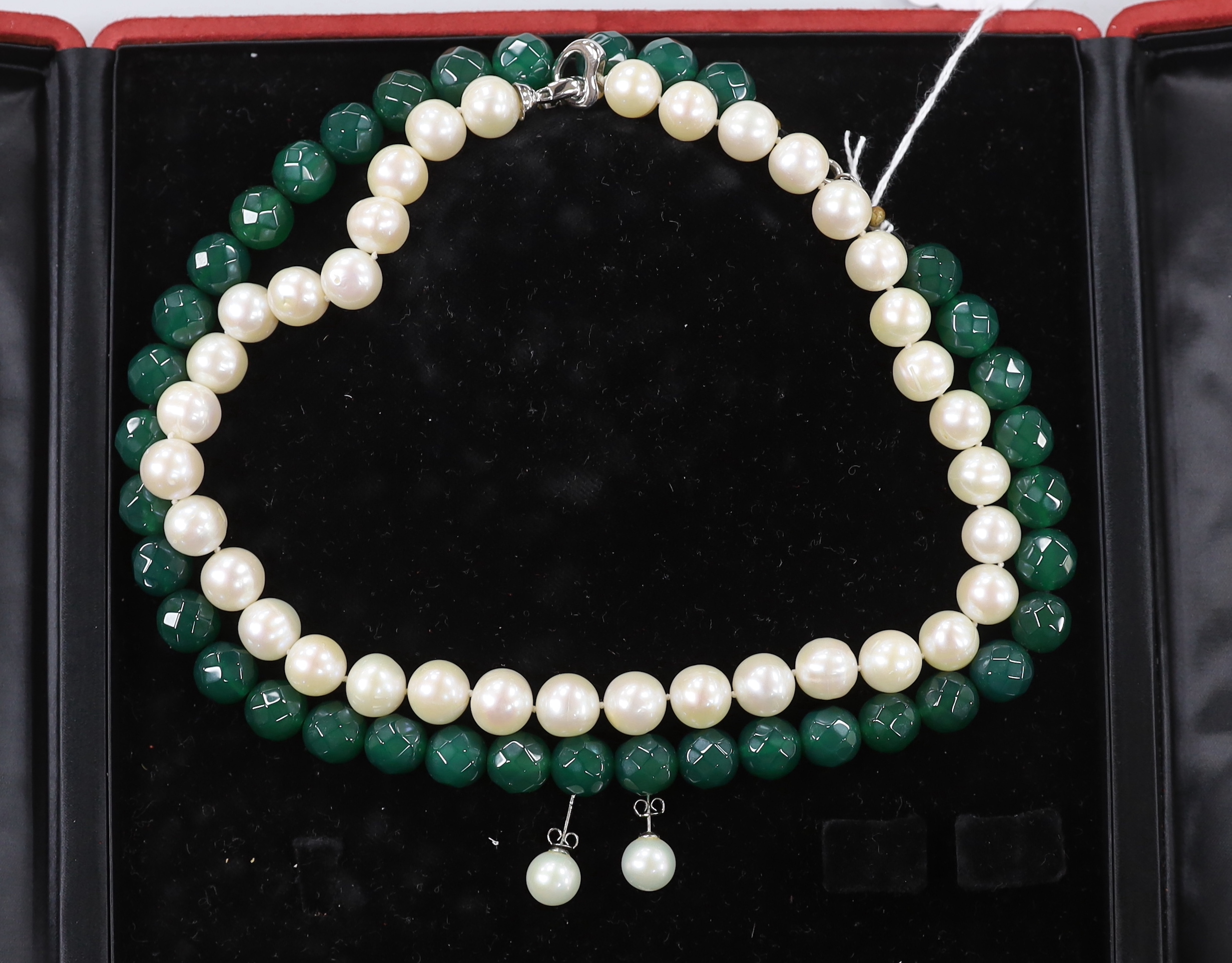 A modern Middle Eastern single strand cultured pearl necklace, with white metal clasp, 42cm, a similar pair of 925 mounted cultured pearl earrings and a facetted chrysoprase? bead necklace.